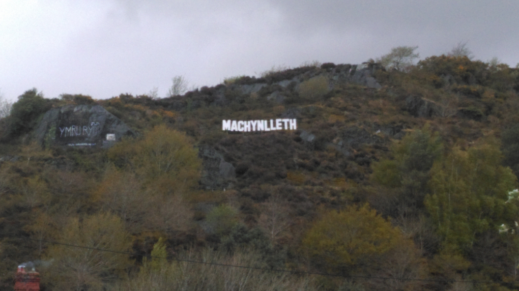 the sign which overlooks the town during the weekend of the Machynlleth Comedy Festival and the Dyfi Enduro