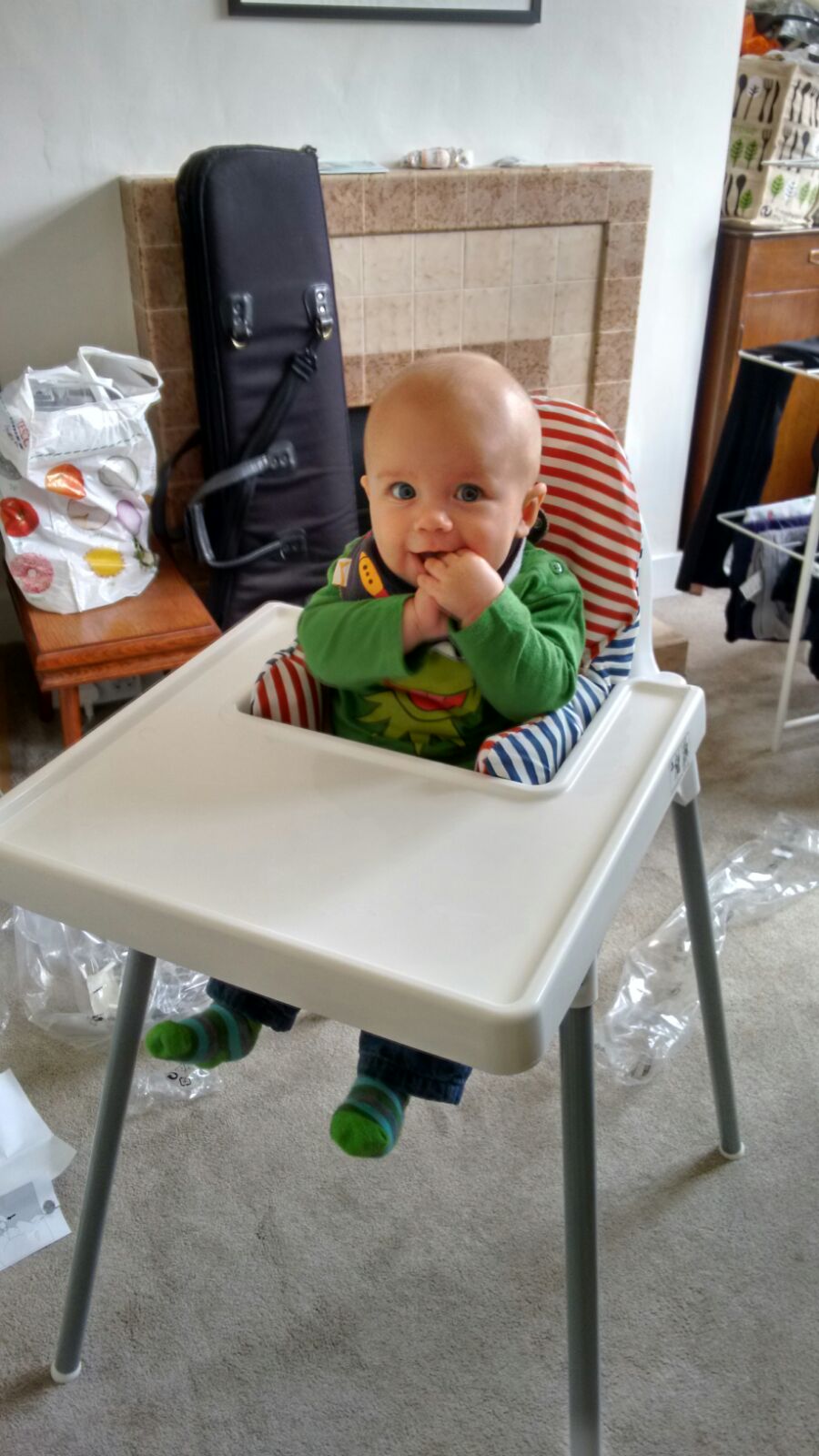 baby in a wipe clean chair