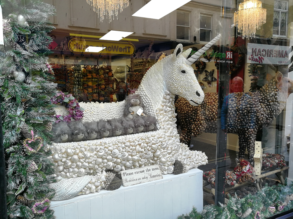 unicorn made of shells in a shop window