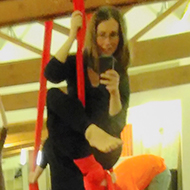 photo in a mirror while hanging from a silk