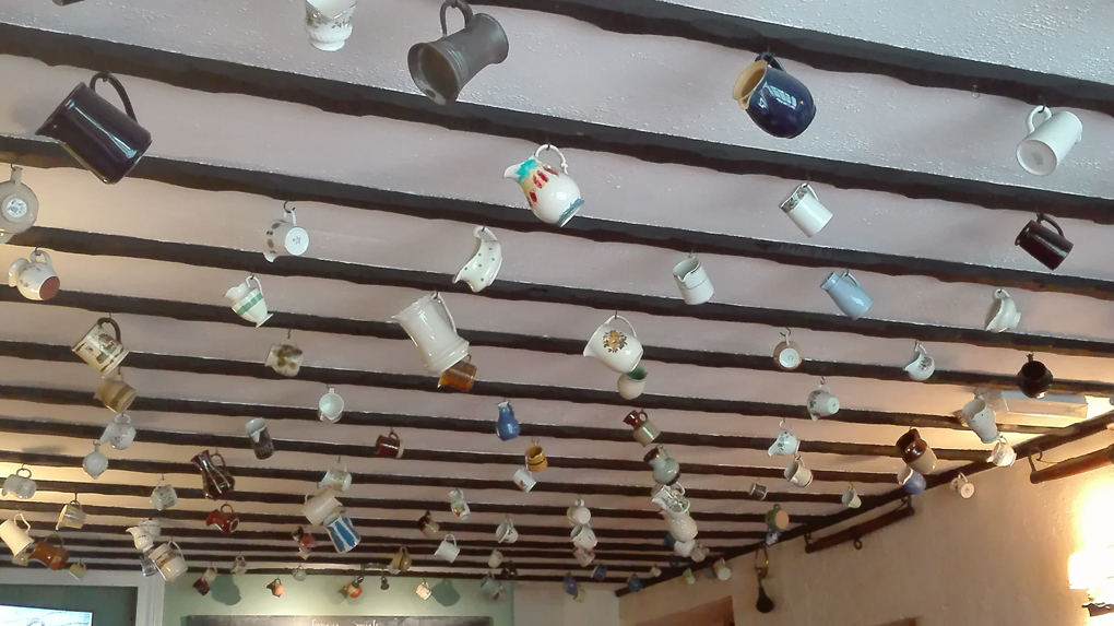 jugs hanging from a roof