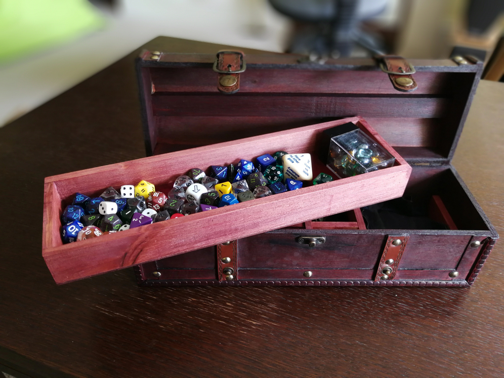 small chest filled with dice
