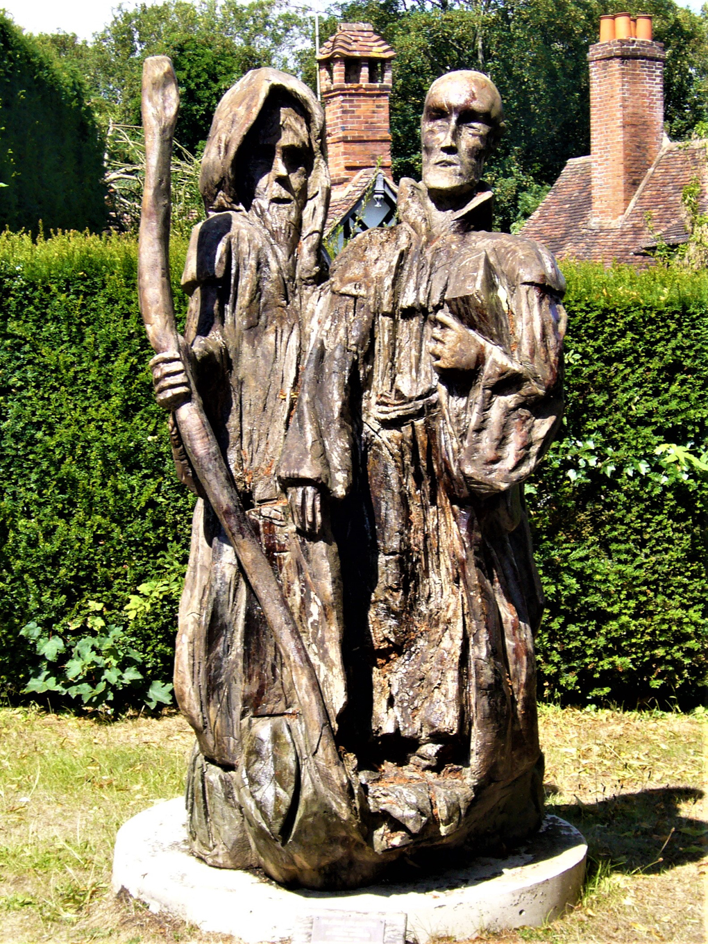 Two carved oak figures standing in Chilham on the Pilgrim's Way to Canterbury.