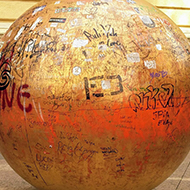 A bronze sphere, 2 metres in diameter, representing the sun and covered in grafitti.