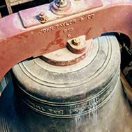 A large bell hung for full circle ringing in Minchinhampton church tower.