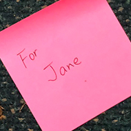 A pink post it note with the words For Jane written on it