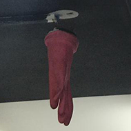 glove over a fire extinguisher in the roof
