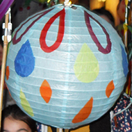 Children and adults with colourful paper lanterns