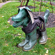 A statue of a dog made from old pairs of wellington boots.
