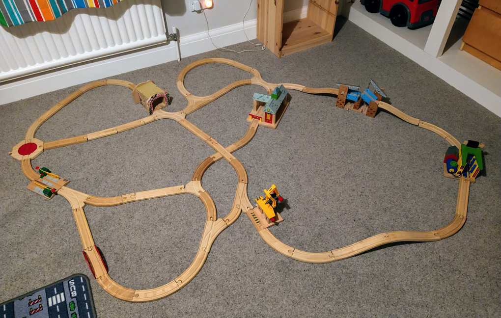 wooden trainset on carpet