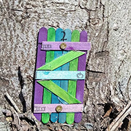 small model door in a tree
