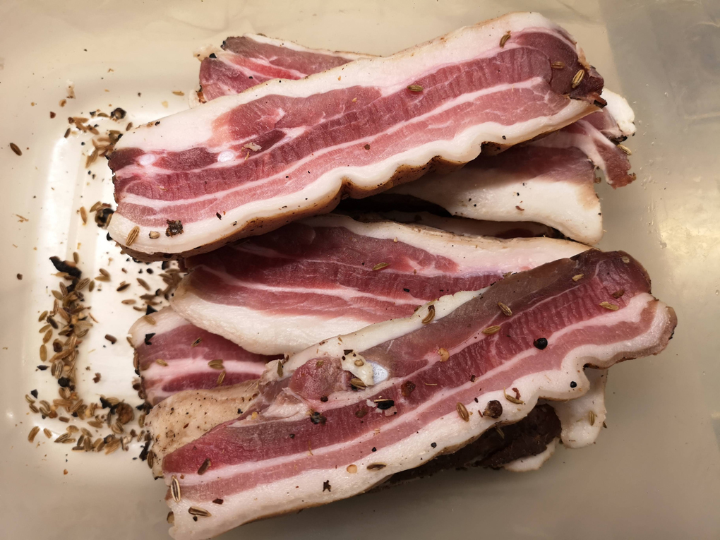 Slices of home-cured pancetta.