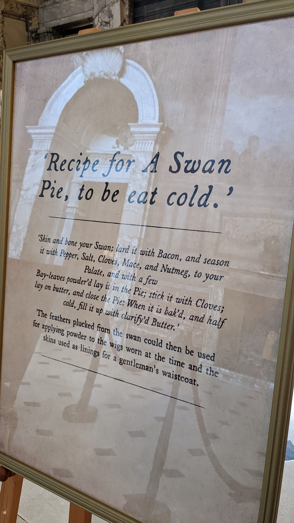 A display in a museum explaining how to make A Swan Pie, complete with suggestions on how to use the leftover feathers in your wig.
