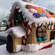 Handmade post box topper, showing a house with santa on the roof