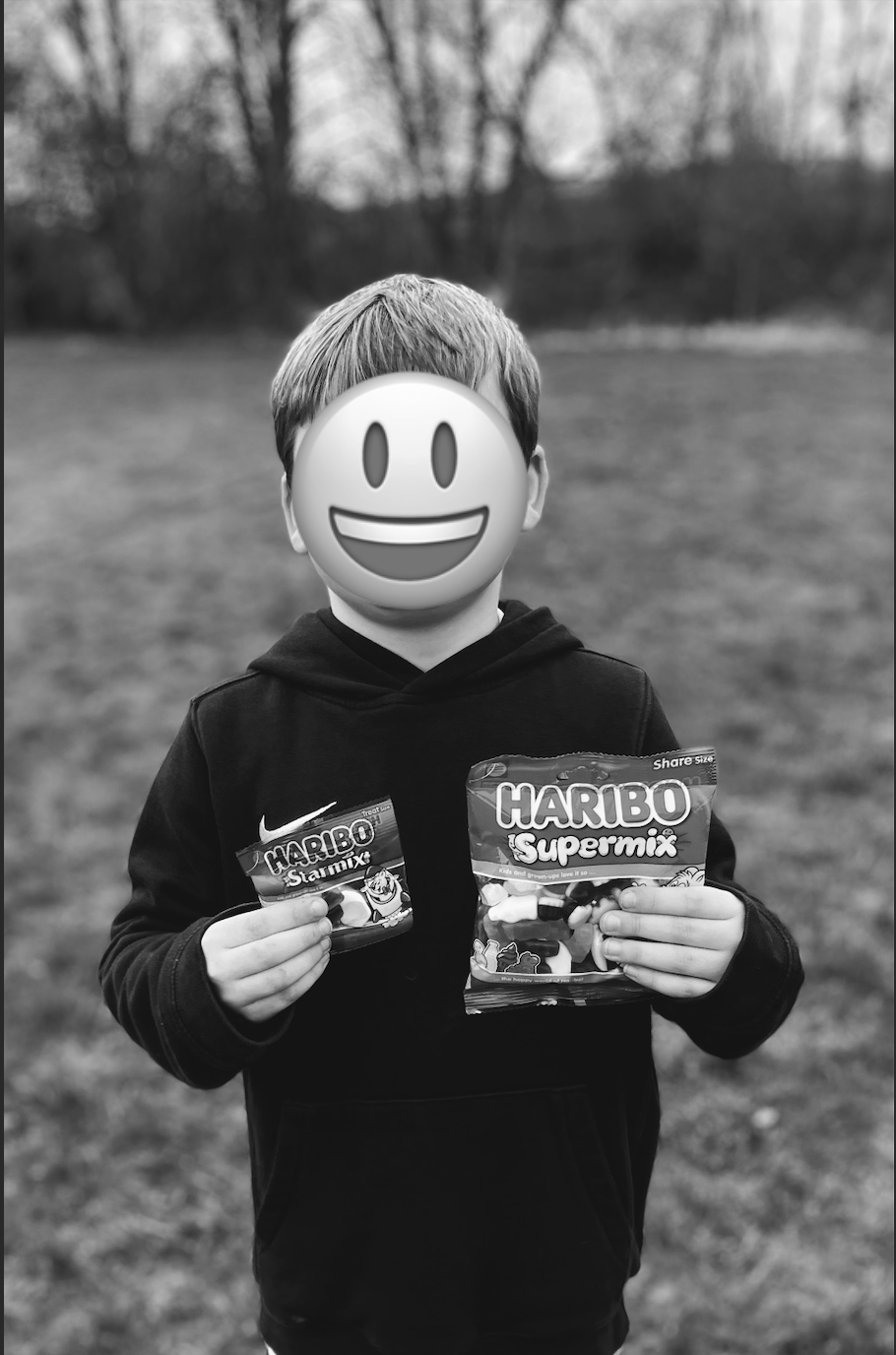 Picture of my son holding 2 bags of Haribo sweets from his football match!