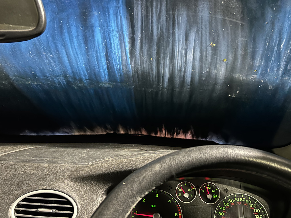 View from dashboard of a car going through a carwash
