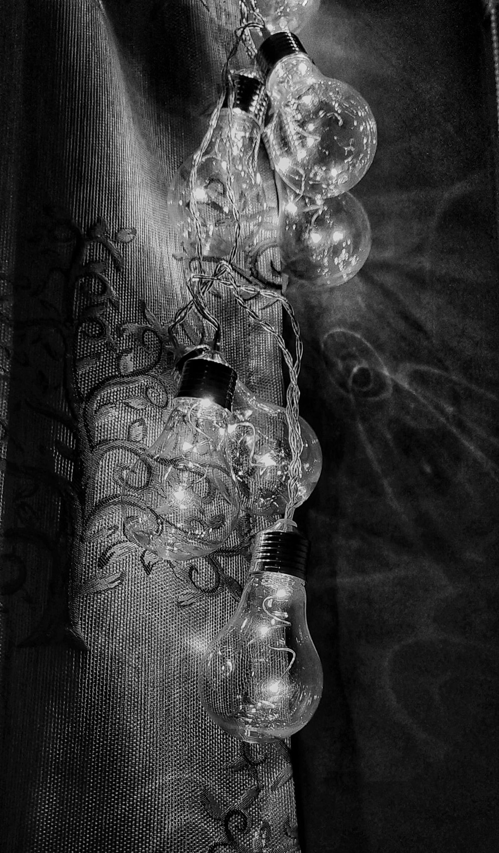 Monochrome image of lights in a window