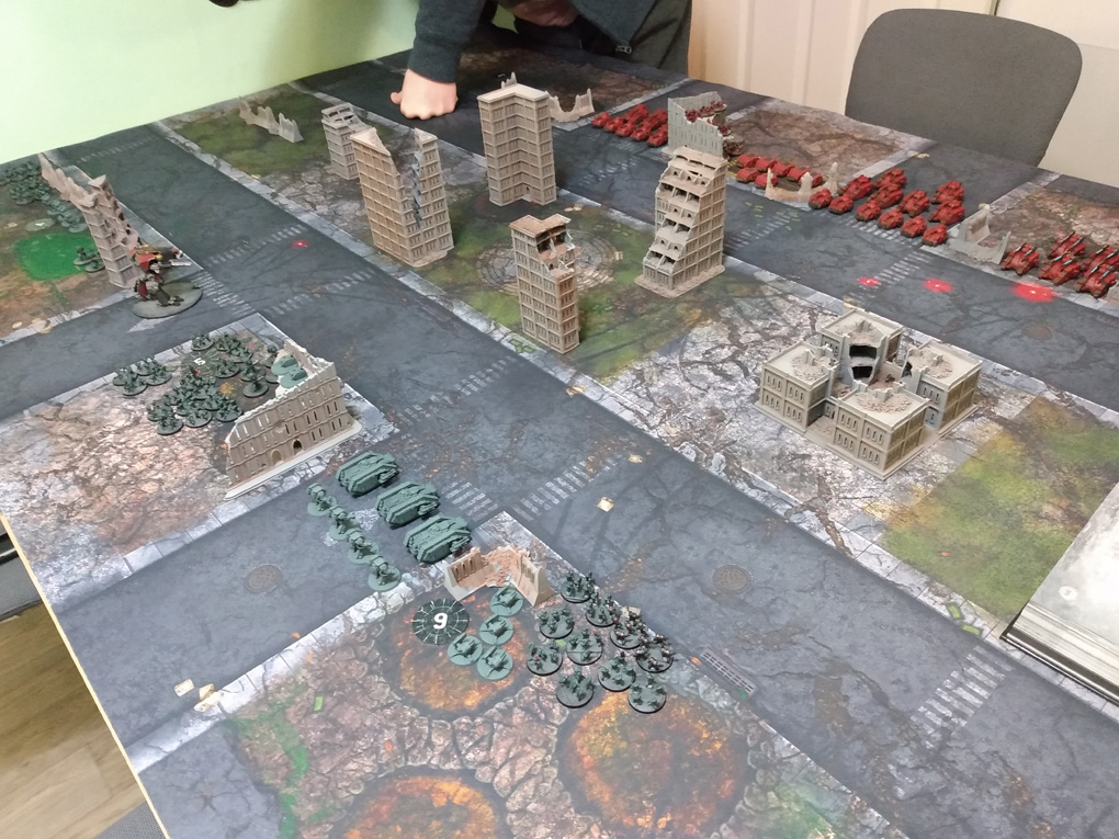 A battlefield is laid out between two forces of miniature armies