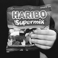 Picture of my son holding 2 bags of Haribo sweets from his football match!
