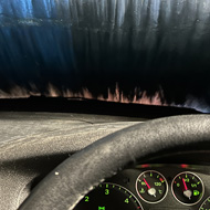 View from dashboard of a car going through a carwash