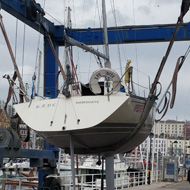 Movable boat lift driving 34 foot yacht through Ramsgate Royal Harbour