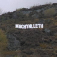the sign which overlooks the town during the weekend of the Machynlleth Comedy Festival and the Dyfi Enduro