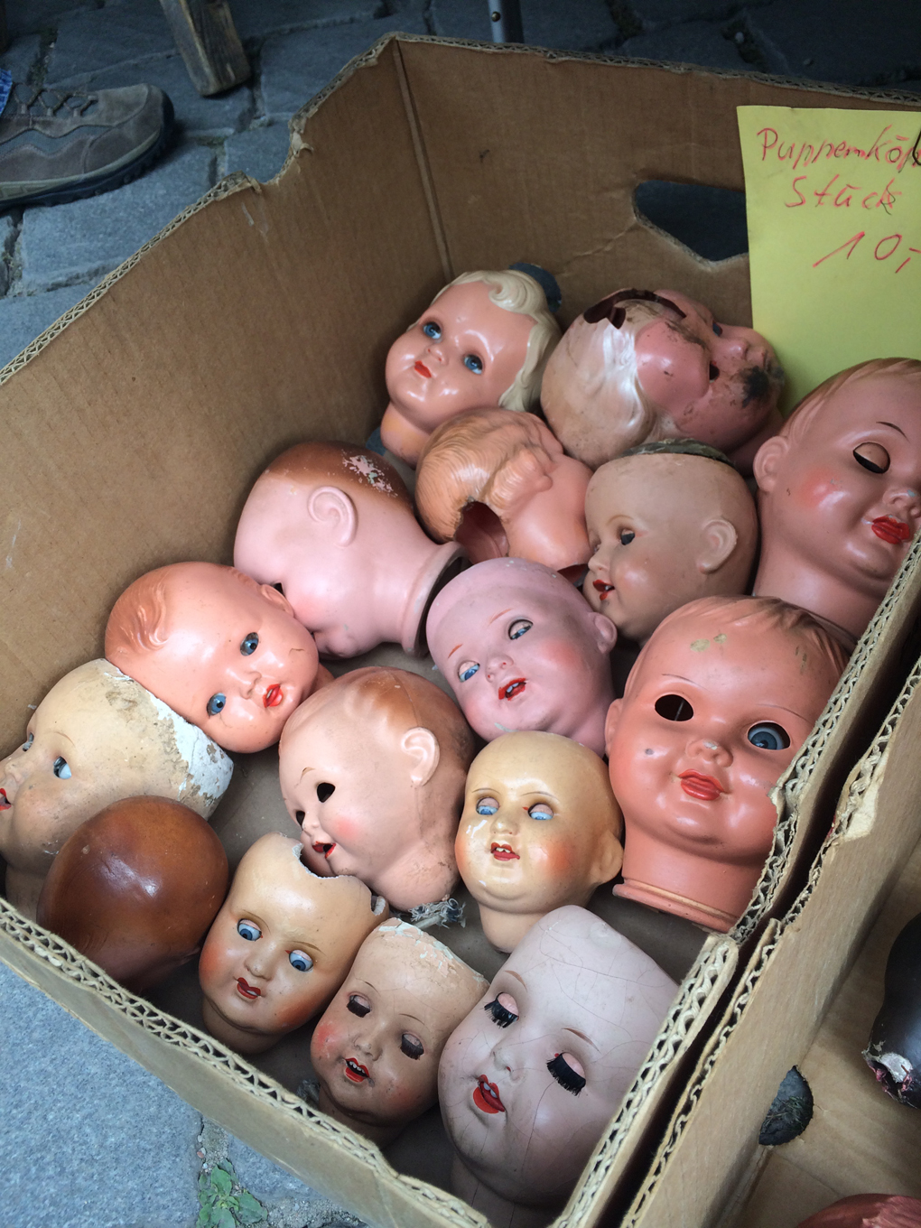 box of doll heads