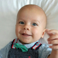baby in a dickie bow