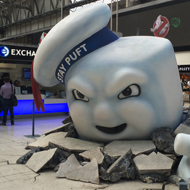 Stay Puft marshmallow man climbing out the ground