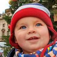 baby in cold weather clothing with father