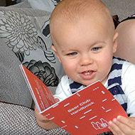 baby reading a book