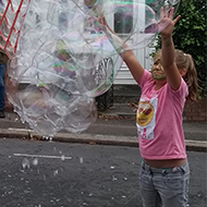 people playing with bubbles