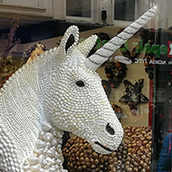 unicorn made of shells in a shop window