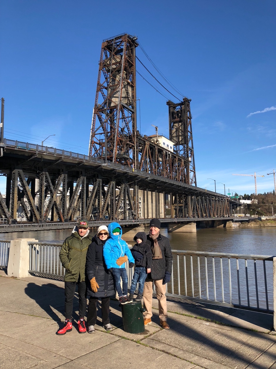 family by a bridge