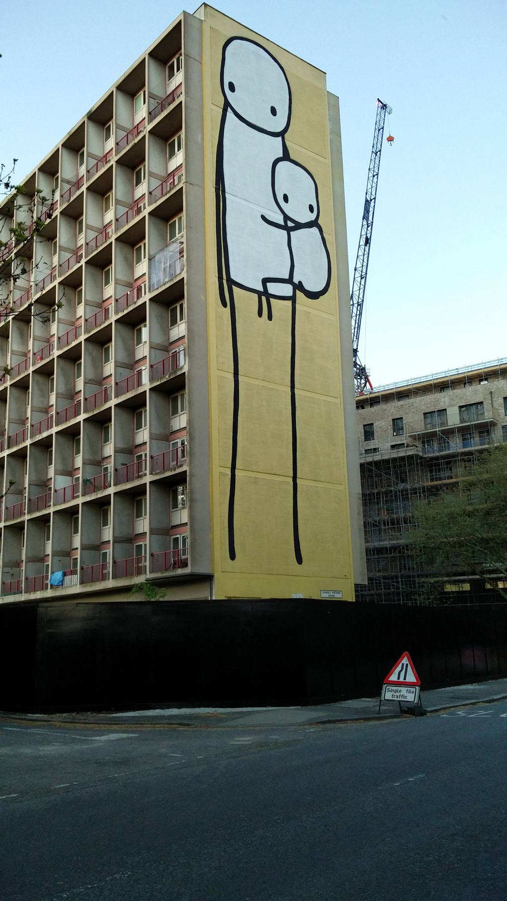 giant stick men on the side of a building
