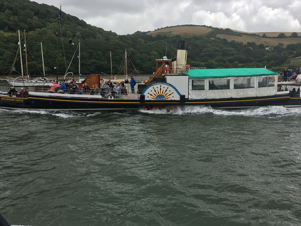 An old steam powered paddle boat traveling up the River Dart from Dartmouth