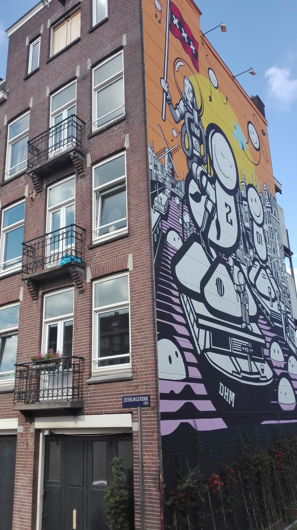 Amsterdam house with graffiti on the side, beautiful graffiti art.