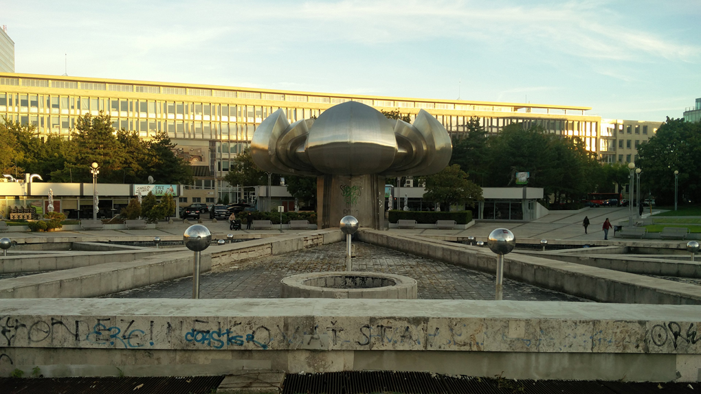 lumpy communist statue in a fountain