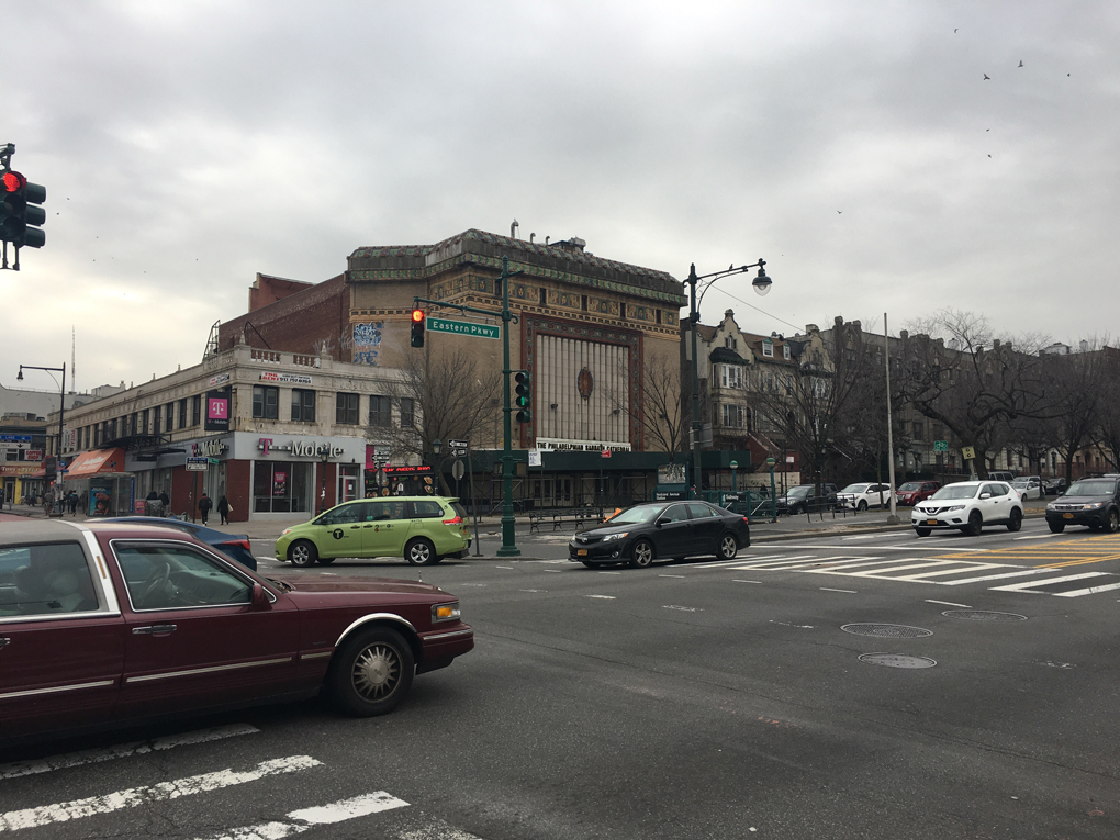 An old movie palace converted to a church on a grey day in Brooklyn