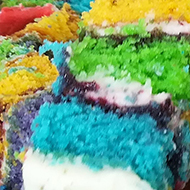 Slices of brightly coloured rainbow cake