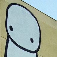 giant stick men on the side of a building