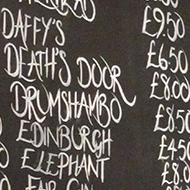 price list of gins in a pub