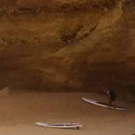 This is a picture of a sea cave in the Algarve near Lagoa. It shows the sun coming through a hole in the ceiling