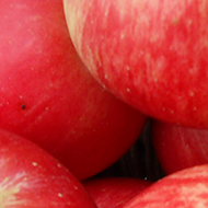 red eating apples in a vintage basket