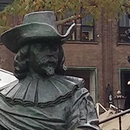 statues of soldiers around a statue of Rembrandt