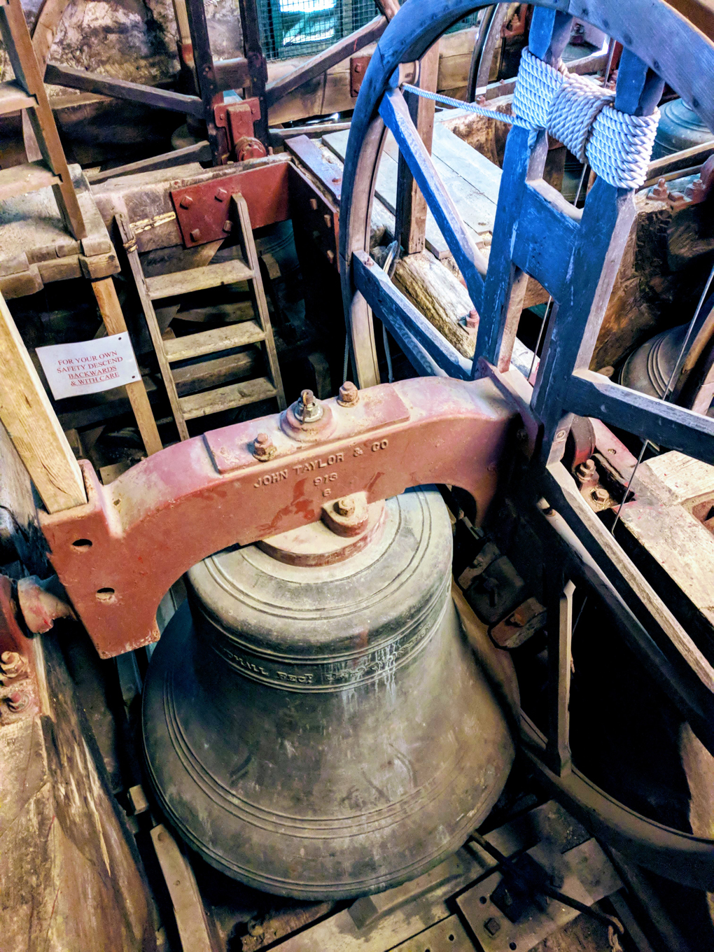 A large bell hung for full circle ringing in Minchinhampton church tower.