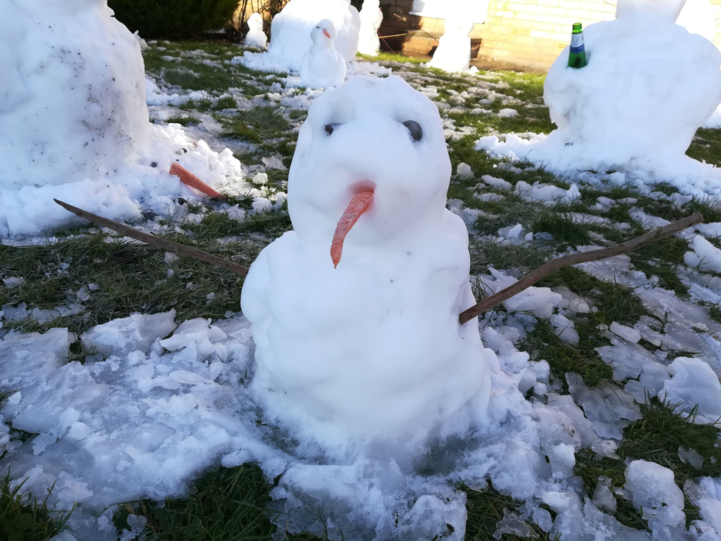 a small, depressed-looking, snow man