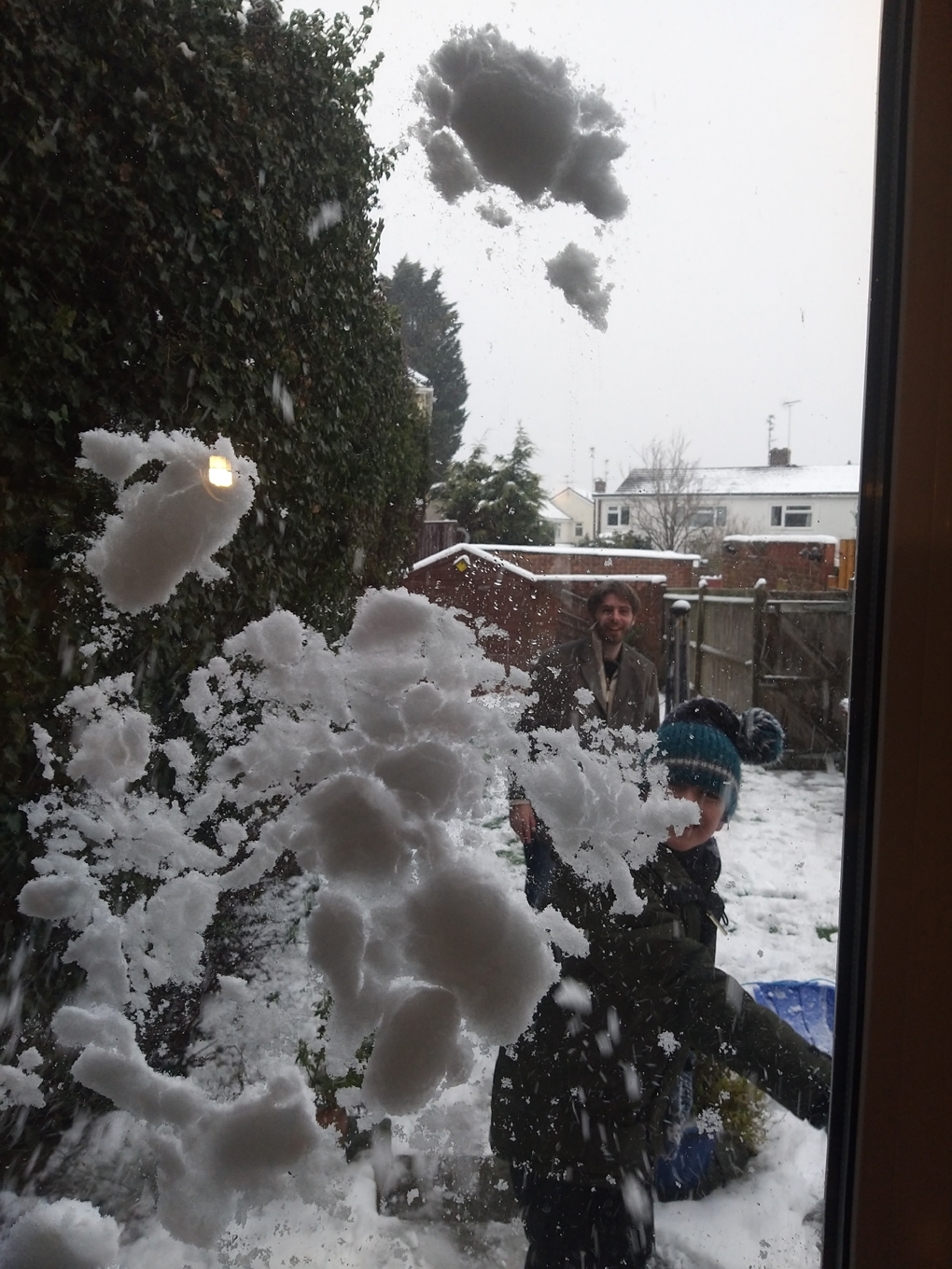 Snowball flattened across a window