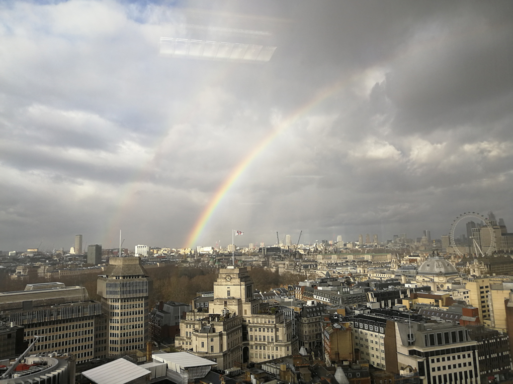 rainbow over London viewed from the top of a tower block
