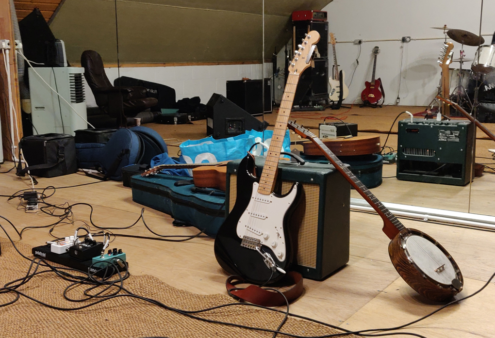 Guitars and amplifiers in a rehearsal studio